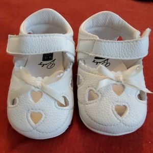 White baby shoes with hearts